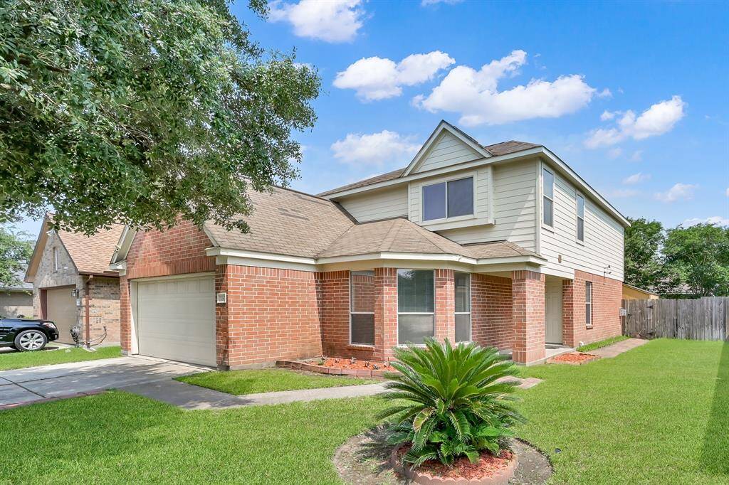 Lush front lawn accents this lovely home