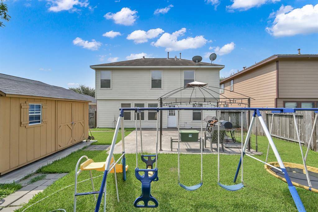 The backyard has space for  a pool, gardening, a playground, or whatever your heart desires.