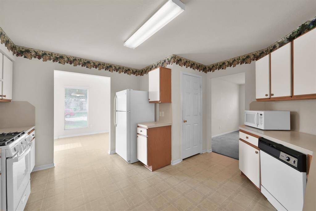 Kitchen offers plenty of cabinet and counter space (refrigerator is not included)