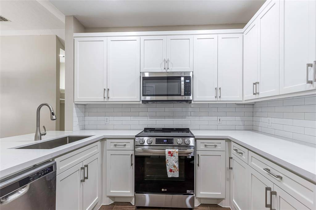 Renovated kitchen with stainless steel appliances