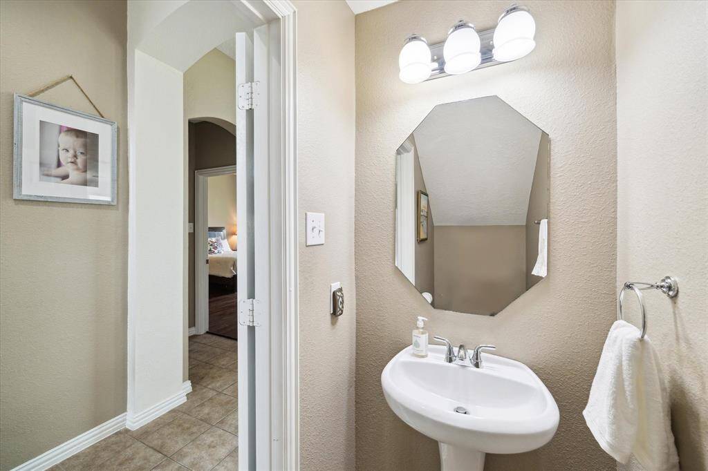 Guest bathroom off of the foyer leading to the living room