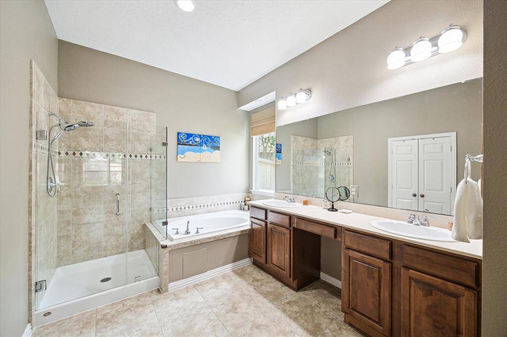 Spa-inspired bath with soaking tub and glass shower