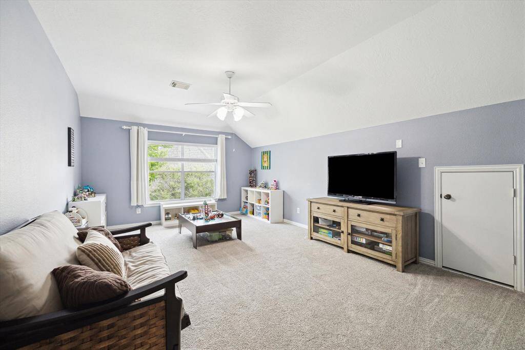 Upstairs game room perfect for entertainment.