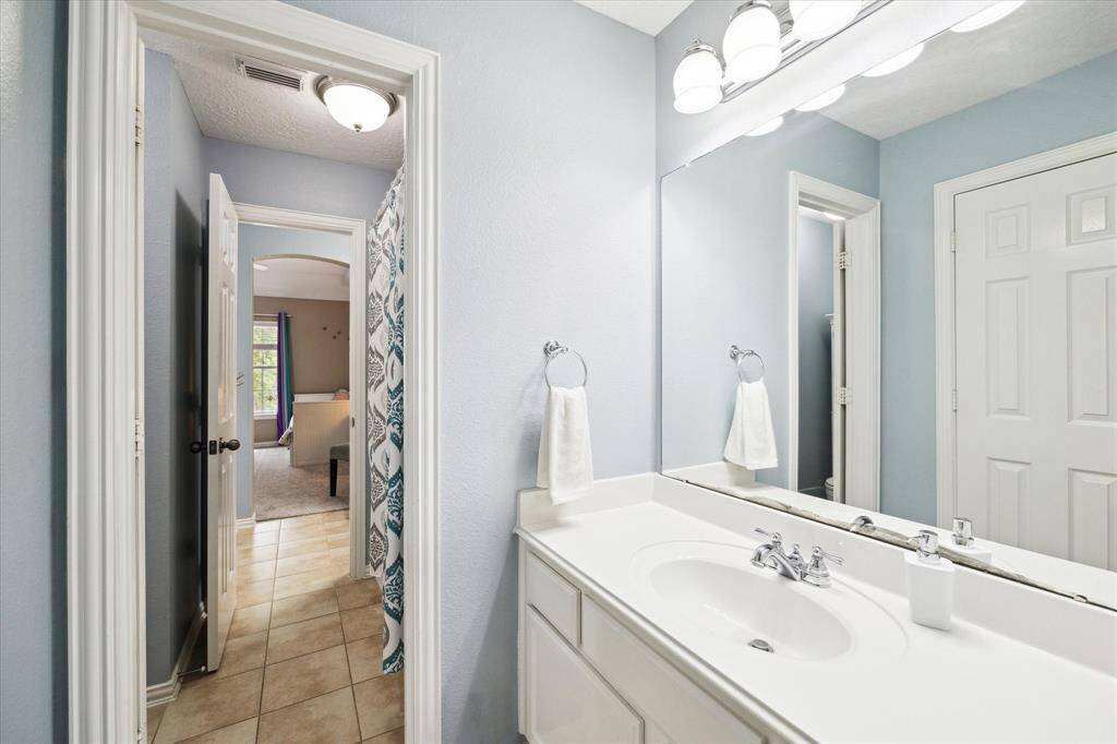 Jack and Jill bathroom connecting two of the secondary bedrooms