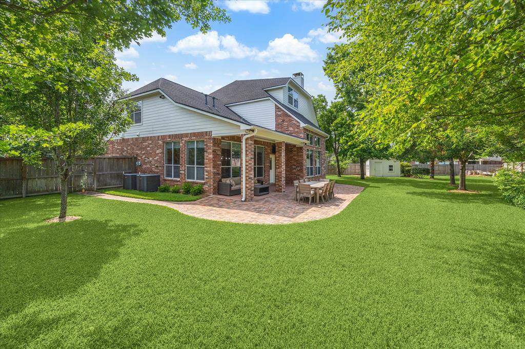 Spacious backyard with covered patio