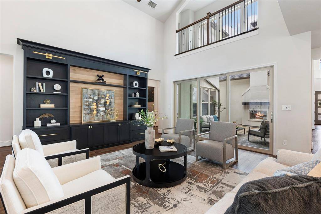To the left is the primary suite.  Off to the right is the tucked away study overlooking the courtyard and adjacent to the 3rd car garage and mudroom.
