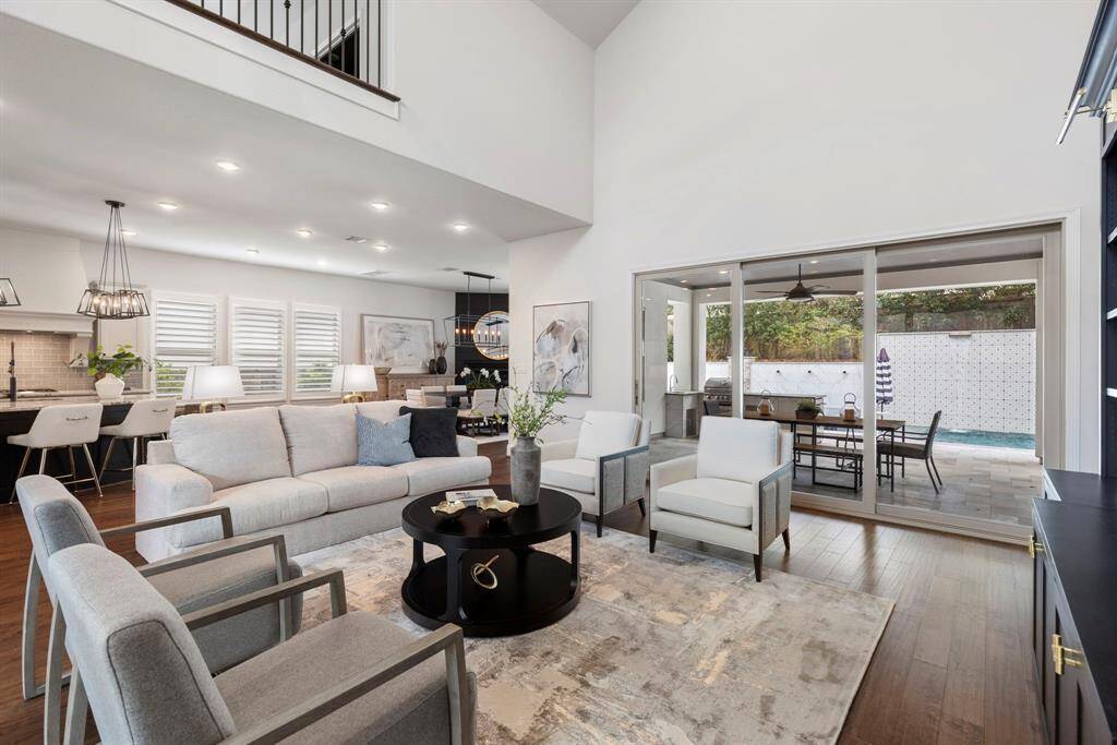 View from the living room to the covered patio and open kitchen.  Ideal for entertaining.