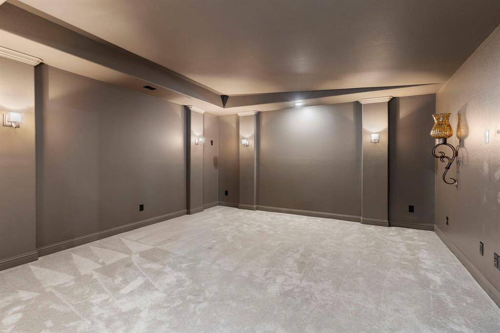 16'x15' media room upstairs, wired for surround sound, projector and screen, or large TV.  The two sconces on the TV wall are decorative and can be removed for wall size screen or TV.