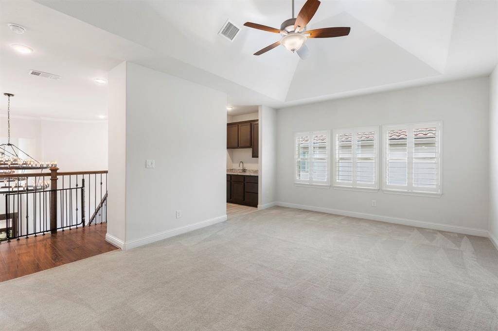 20'x14' gameroom.  Attached is a wet bar, half bath, and unfinished storage/gym/craft space hidden behind the half bath.