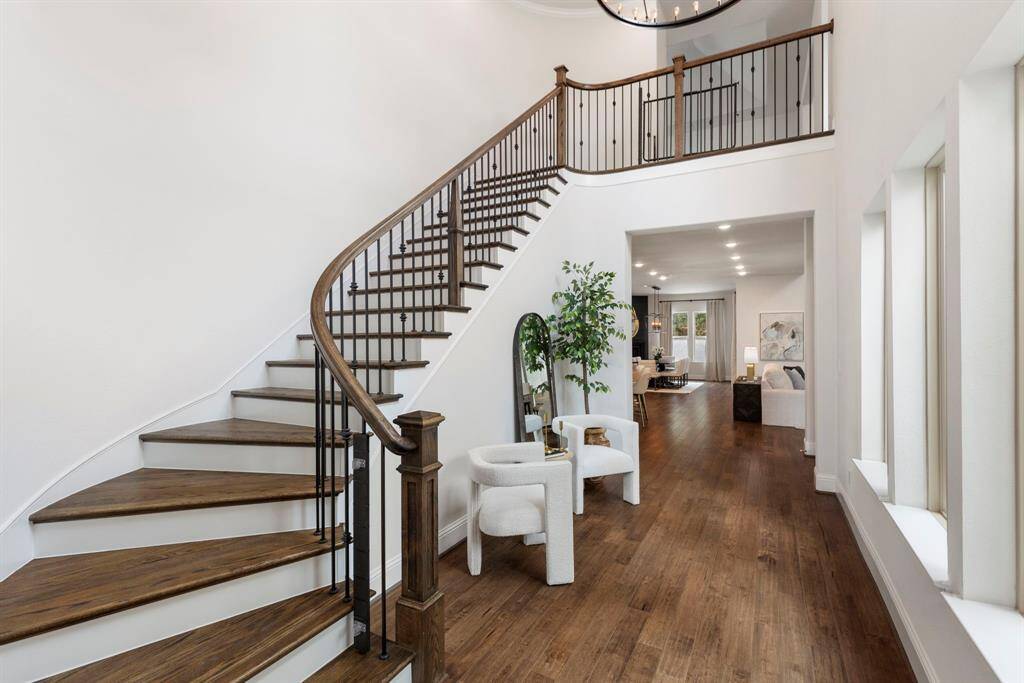Grand staircase behind the downstairs 2nd bedroom suite