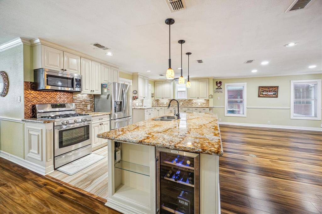 Kitchen offers ample storage and counter space, providing plenty of room for cooking and organization.