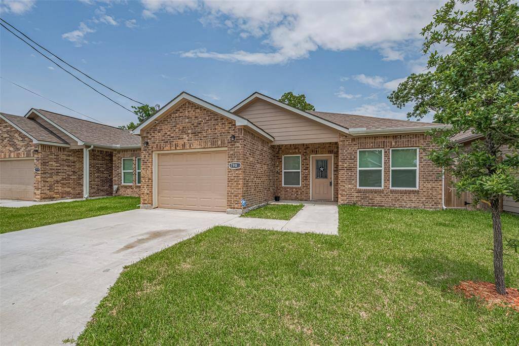 Charming brick home, neat lawn, and a welcoming front porch. Ideal for comfortable living.