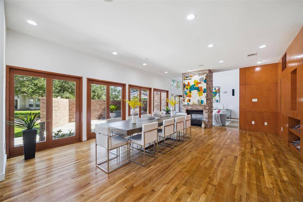 Dining Area ... Spacious with lots of natural light ... double sided fireplace shared between Family Living Room