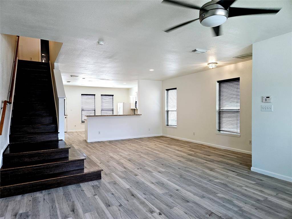 view from living into kitchen and stairs