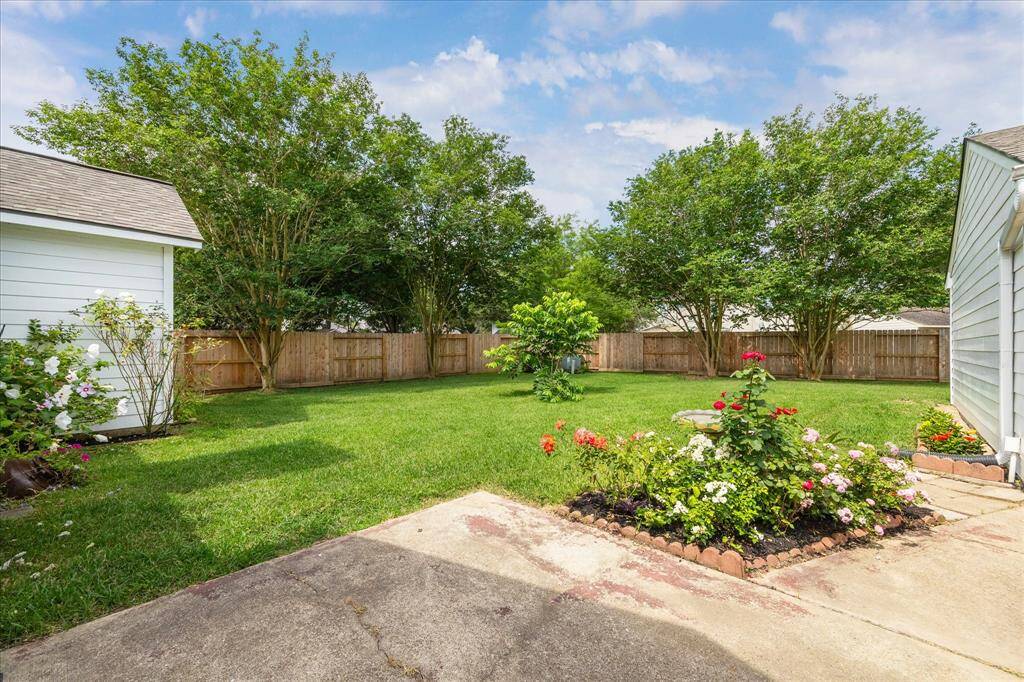 NEW FENCE, NEW ROOF, NEW SIDING, AND A LOW MAINTENANCE BACKYARD READY FOR ENJOYMENT.