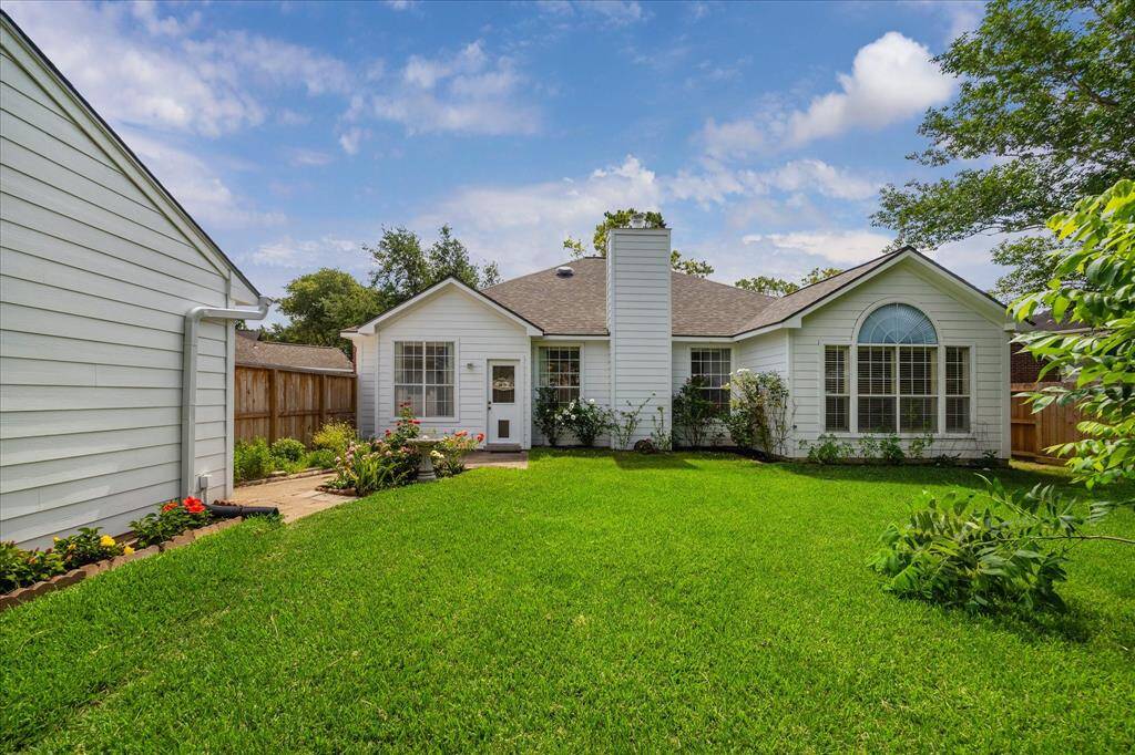 STEP INTO THE YOUR BACKYARD OASIS - SURROUNDED BY A BRAND NEW WOODEN FENCE.