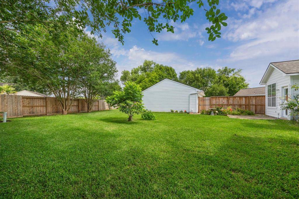 GENEROUS BACKYARD GREEN SPACE.