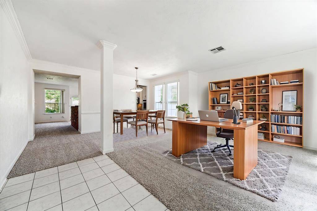 DINING-STUDY ROOM COMBO WITH TONS OF NATURAL LIGHT AND CARPETING THROUGHOUT. **This room has been virtually staged.