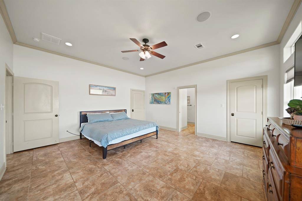 Ample room for a king-sized bed and additional furniture, plus private French doors leading to the wraparound deck.