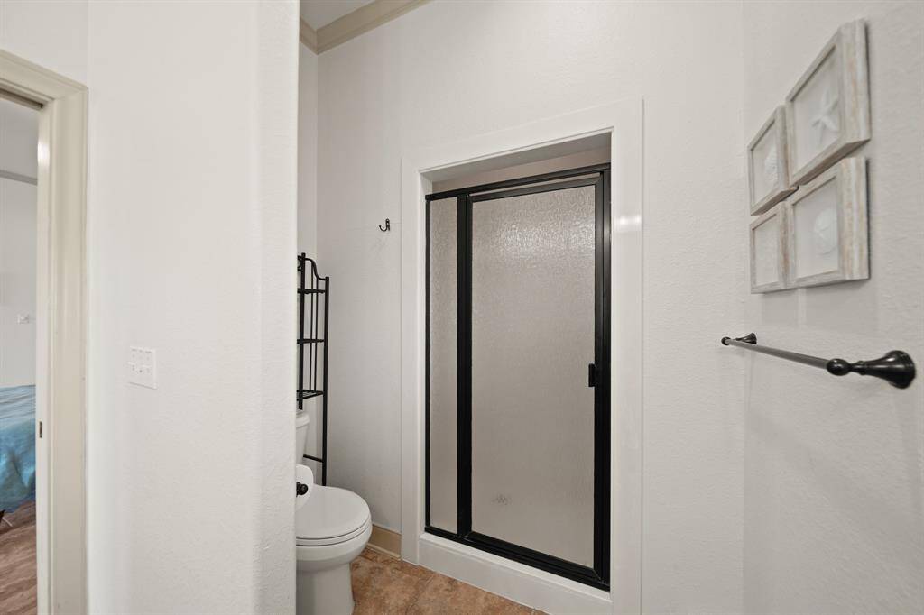 The primary bathroom includes a separate water closet and walk-in shower for added privacy and convenience.