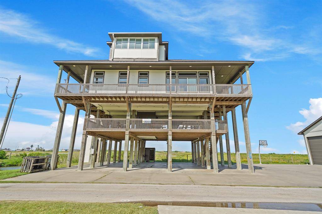 Designed with both shade and sunshine in mind, these outdoor spaces are ideal for lounging, dining, or simply enjoying the elevated views of the colorful beachside neighborhood and water inlets beyond.