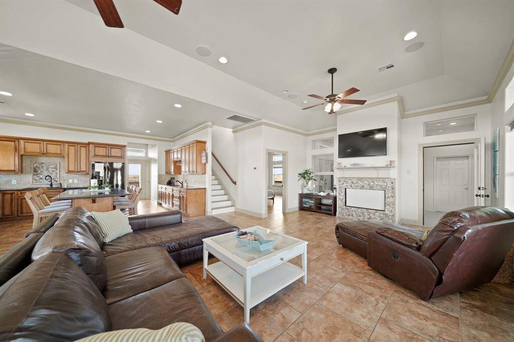 Seamless flow between the living room and kitchen allows for effortless entertaining, with plenty of room to relax and host.