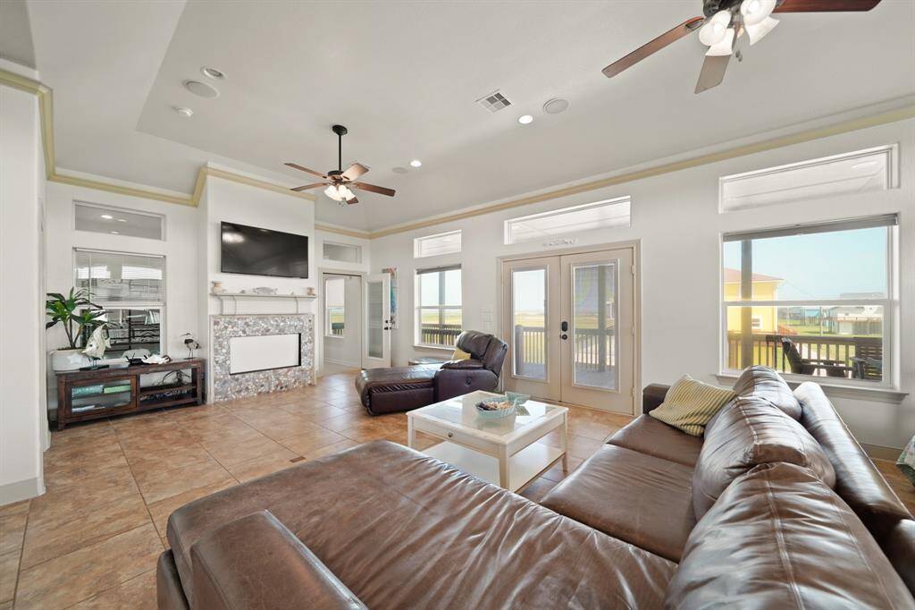 Enjoy peaceful views of the Gulf and surrounding homes from the comfort of your living room—this is coastal living at its best.