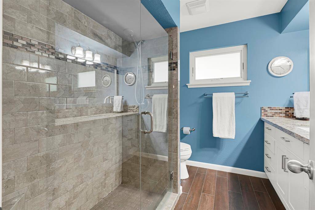The Spacious Shower in the Guest Bathroom echoes the style and sophistication of the primary suite, featuring matching design elements for a cohesive and elegant look.