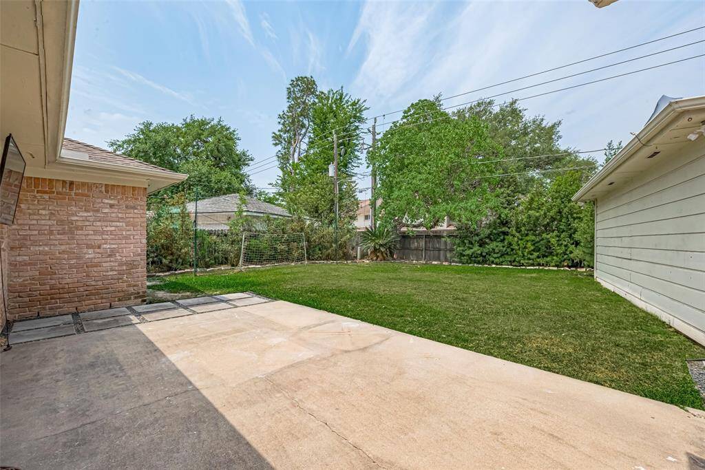 The patio is a generous size and would accommodate both dining and lounging furniture.