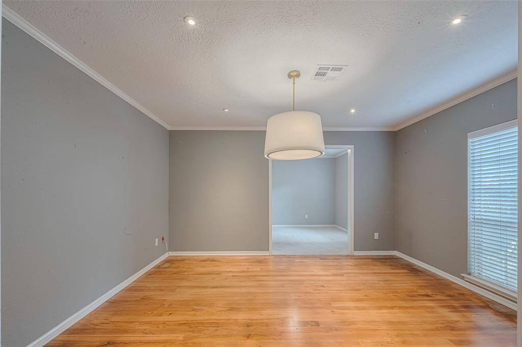 Wood floors carry into the dining room which offers space for your large gatherings.