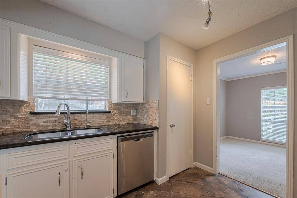 The kitchen offers a spacious pantry.