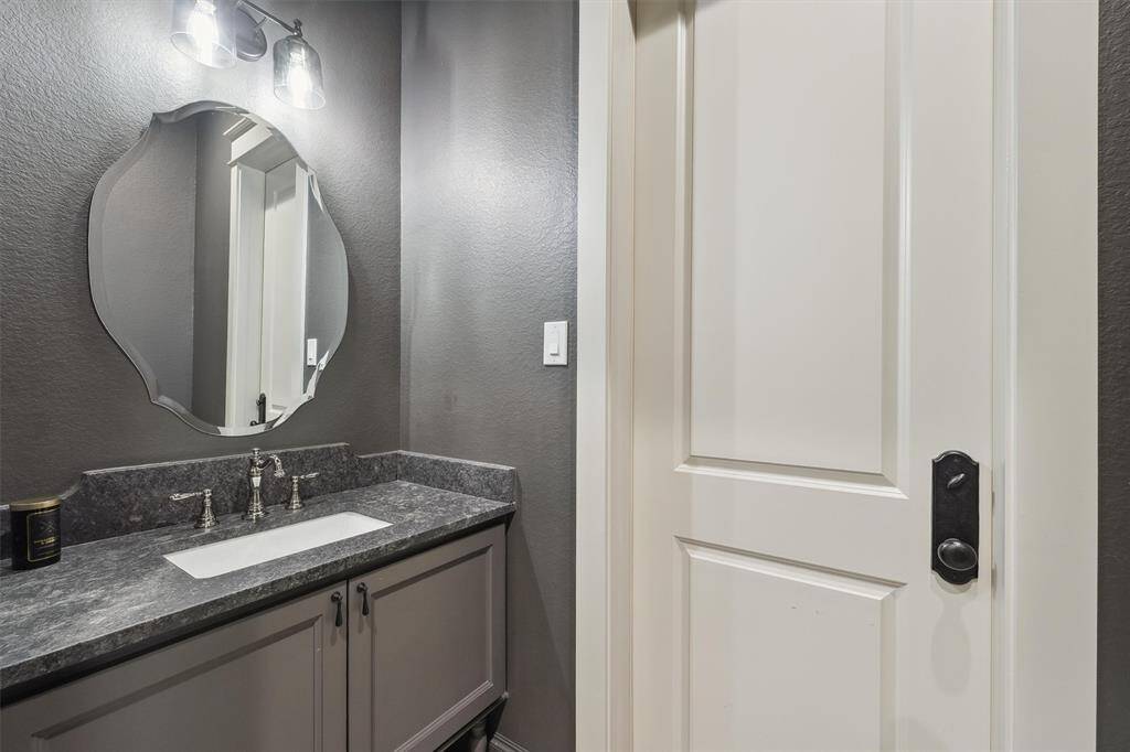 Powder room conveniently located just off pool entrance for guests.