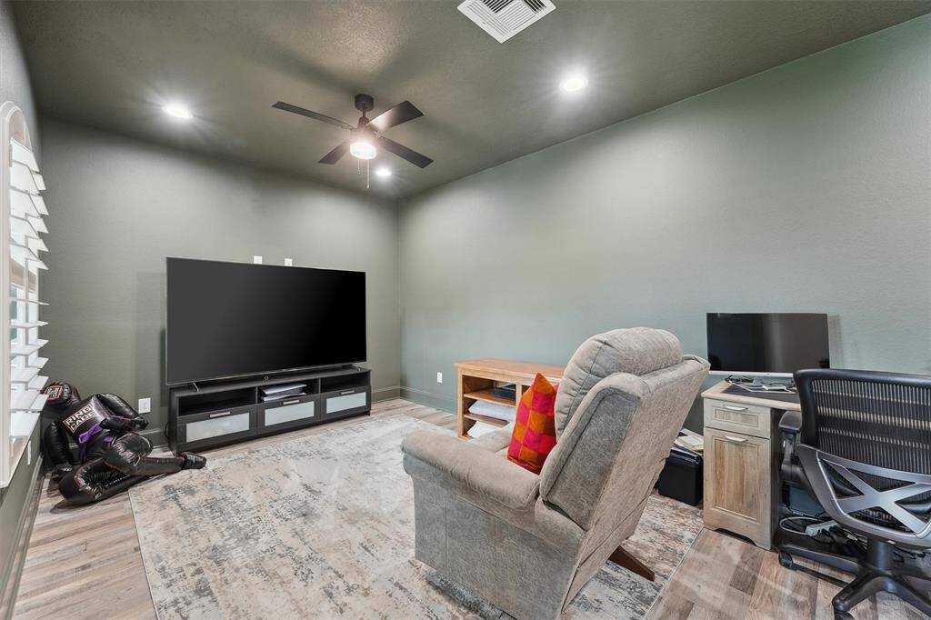 Spacious upstairs media room with views towards the bay.