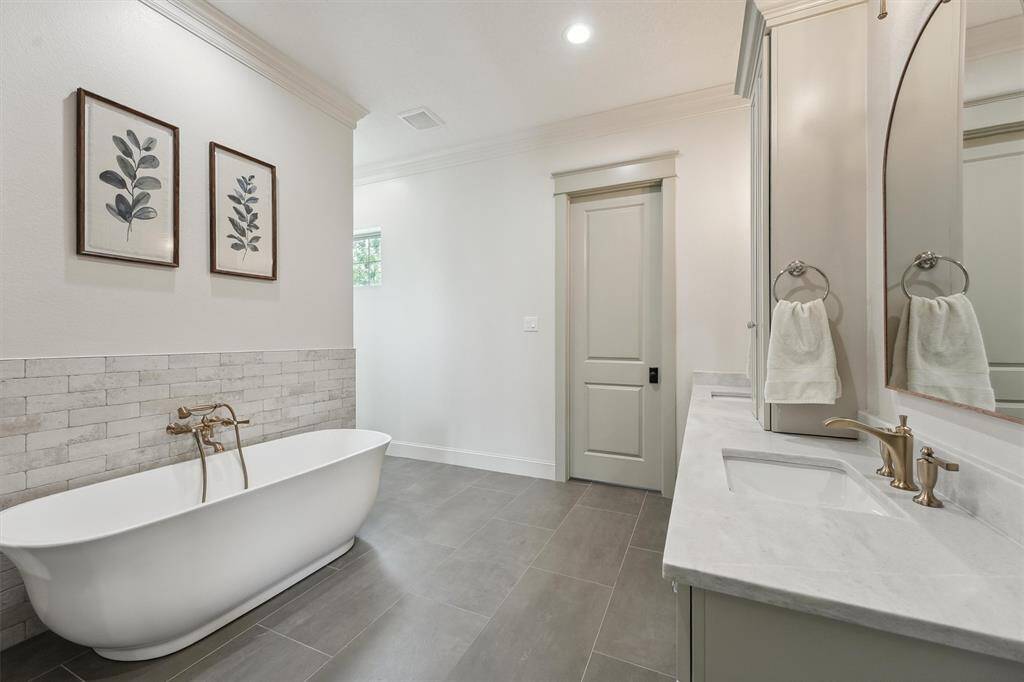 Elegant primary suite with soaker tub.