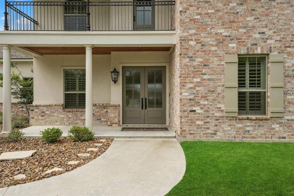 Walk out patio on second floor with custom iron railing and views of the bay!