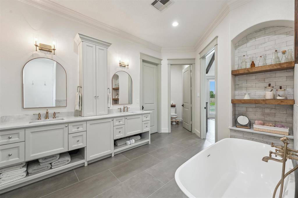 His and her vanities with so much built-in storage.