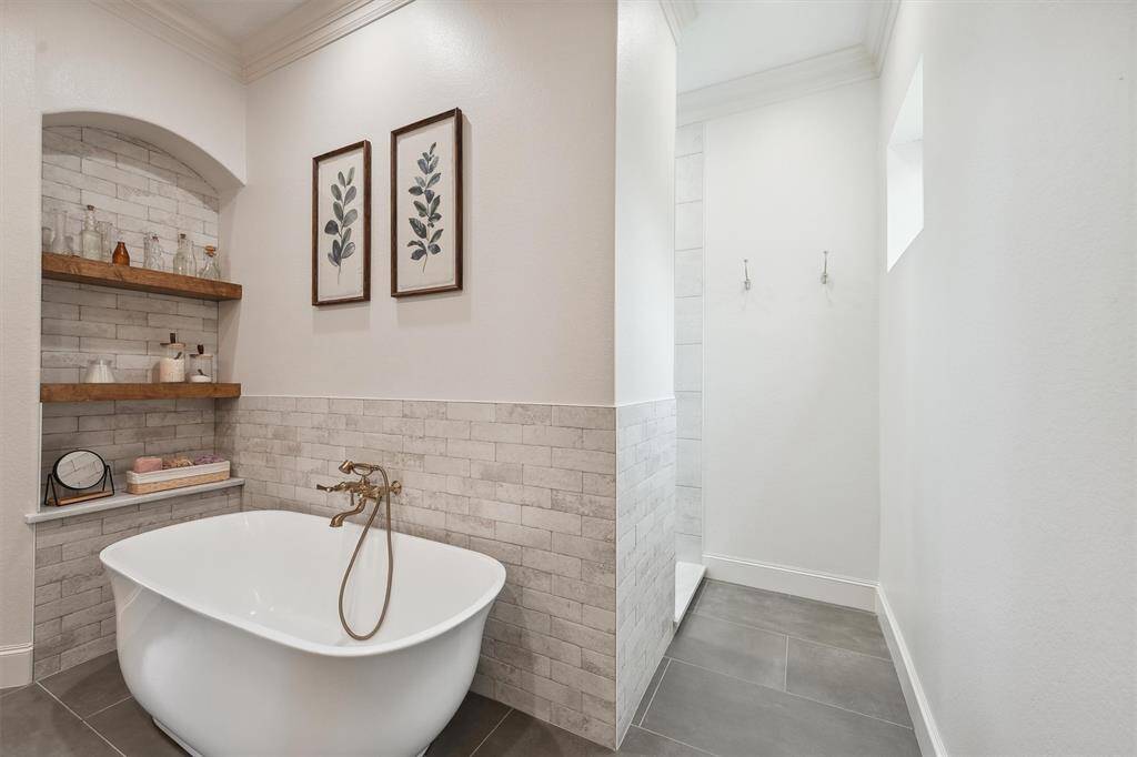 Soaker tub with entrance to walk-in shower.