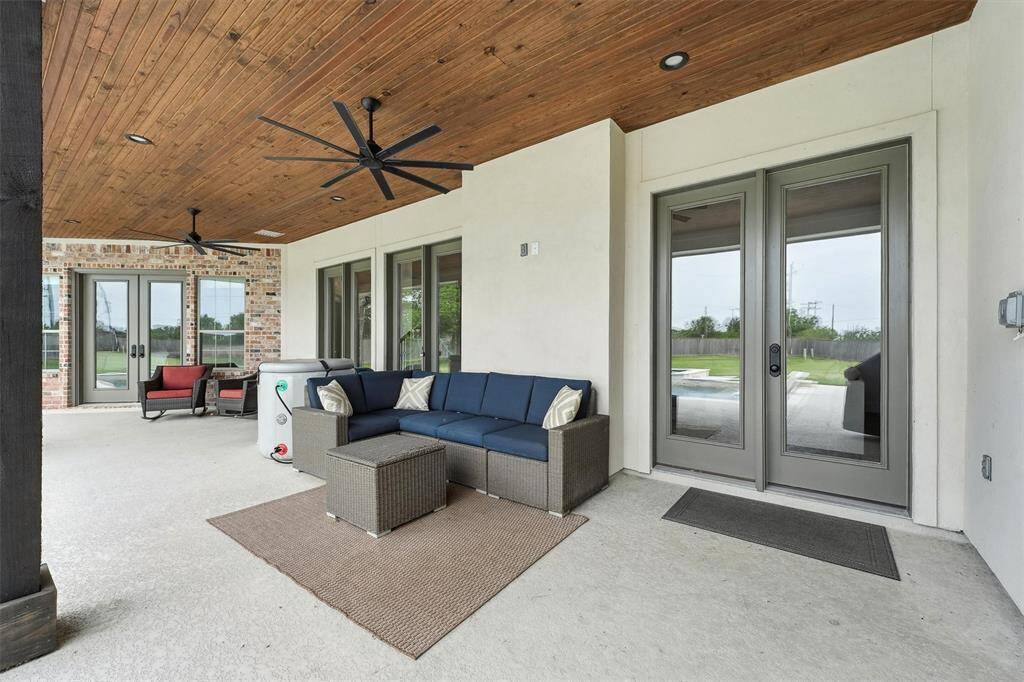 Large covered patio with ceiling fans to enjoy even during the warm months.