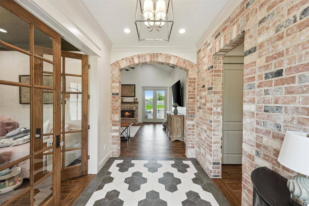 Formal entry with unique tile floor design.