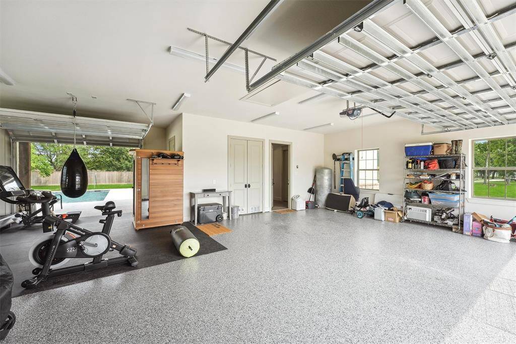 Garage has unique pass through door to backyard oasis.