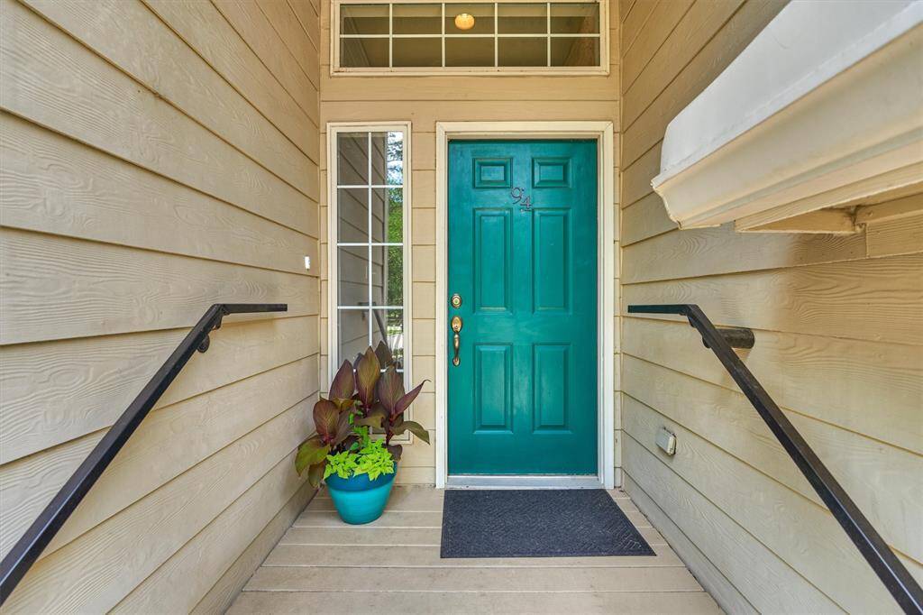 Covered porch offers protection from the elements and eye-catching front door!