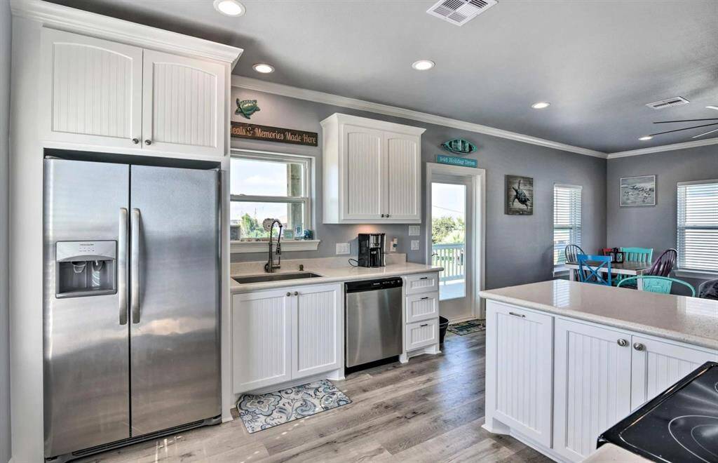 Open Concept kitchen with stainless steel appliances.
