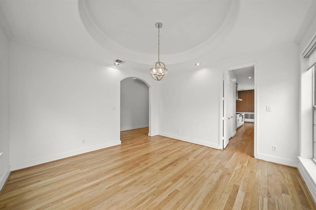 Additional Amenities in the Dining Area include Brand New (April 2025) Refinished Natural Hardwood Floors, LED Recessed Lighting, Fresh Designer Paint, and Crown Molding.  The Butler's Pantry Conveniently adjoins the Dining Area and the Kitchen.