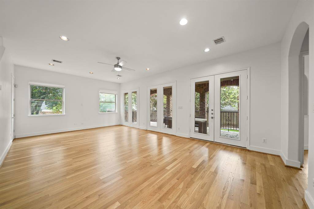 The Living Area is Spacious and Bright!  Soft, Natural Light streams into the Room through Glass French Doors and Large Picture Sized Windows.  This Open Floorplan is Perfect for Entertaining or Relaxing with Family!