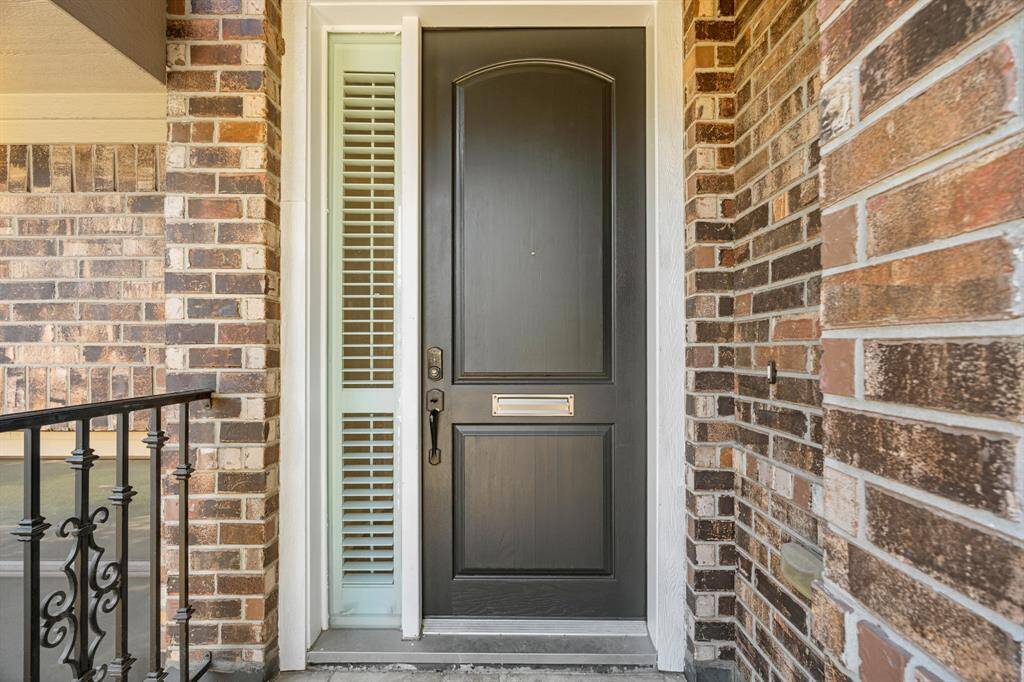 The Front Porch features a Freshly Painted Solid Wood Front Door and Sidelight.