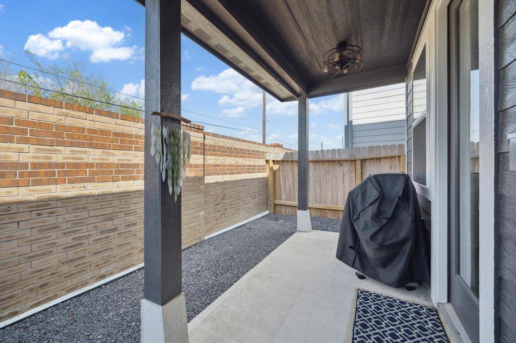 Additional view of back yard. Landscaping has been updated to black rocks.