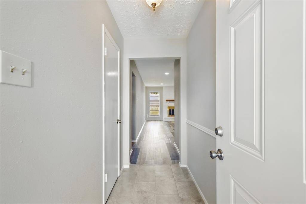Entryway features storage closet on the left, and light and bright foyer to welcome guest to the living room.