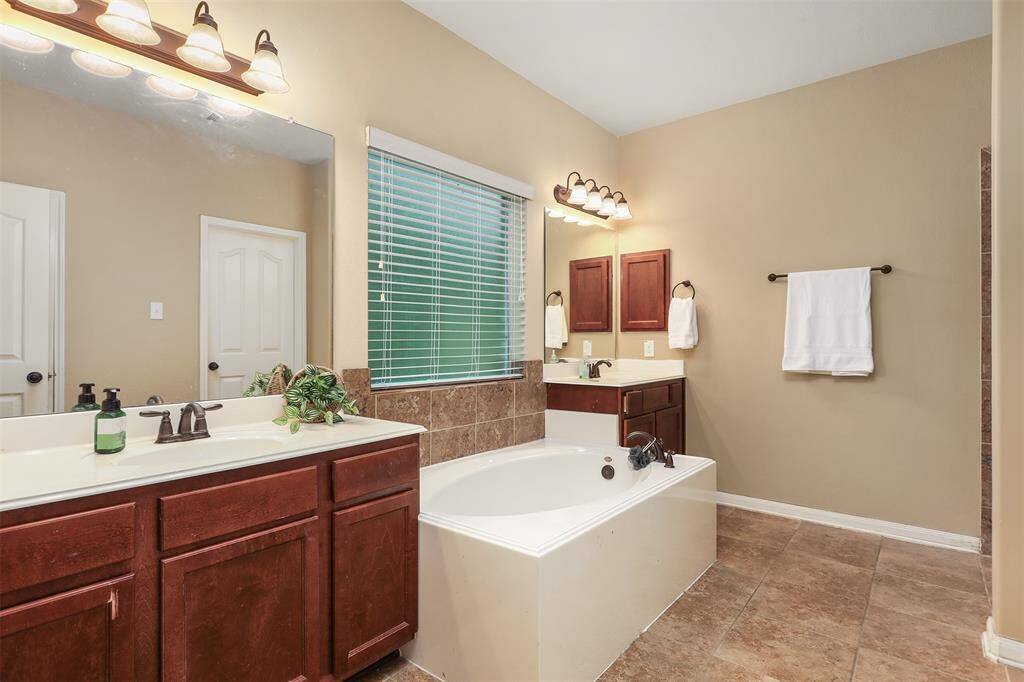 Bath 1 has Double Sinks and Soaking Tub
