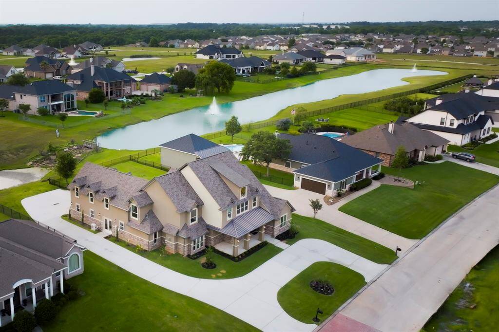 14,000+ sqft lot with serene water views , this stunning home offers exceptional curb appeal, generous outdoor space, and close proximity to the community lake and walking trails.
