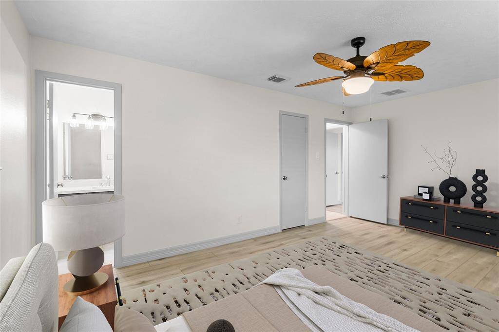 The primary closet is accessed through the door in the middle, and the primary bathroom is to the left.*Virtually Staged